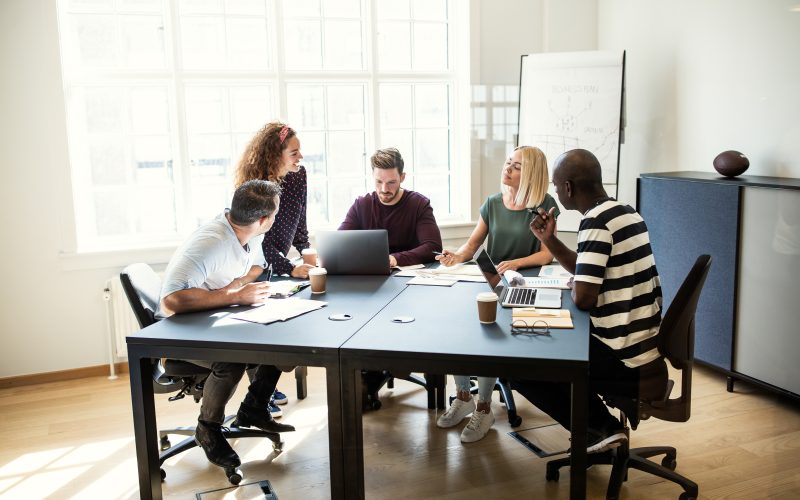 Designers working on a project together in an office